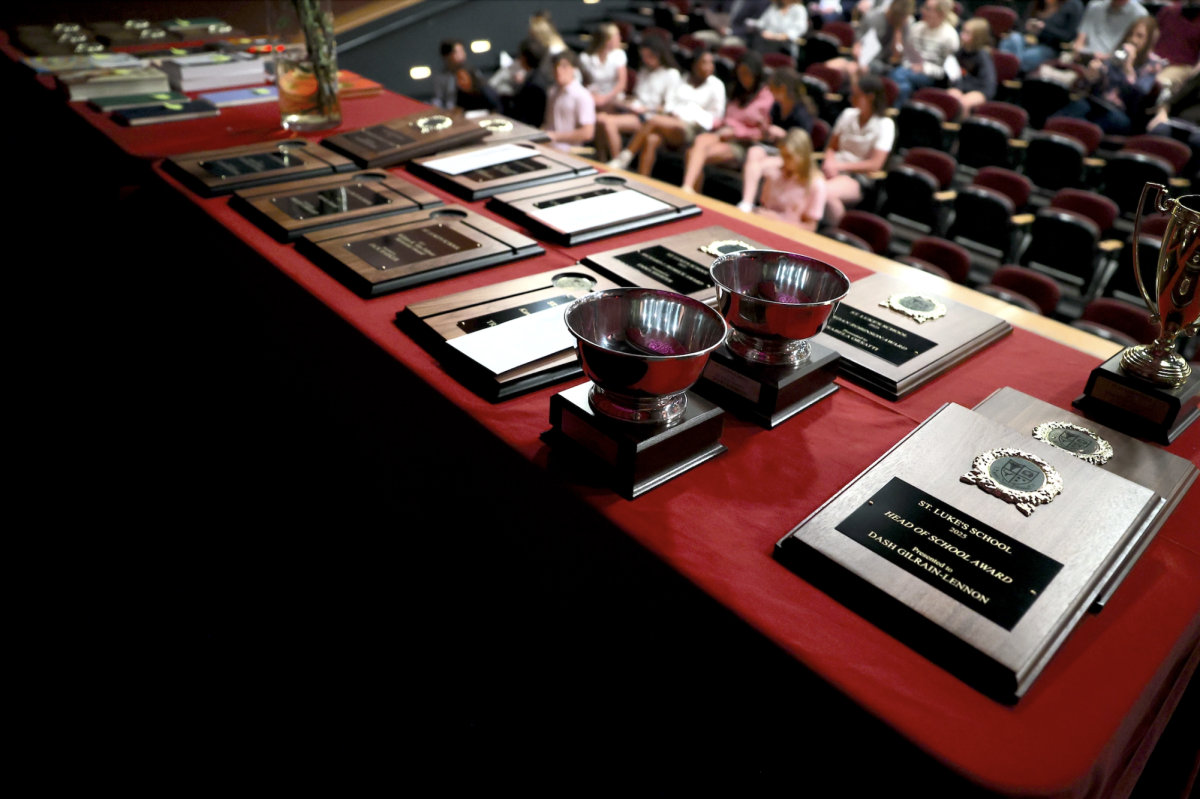 Awards presented at the Upper School Awards Night laid on the table before the start of the ceremony. 